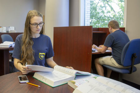 student in the Academic Success Center studying