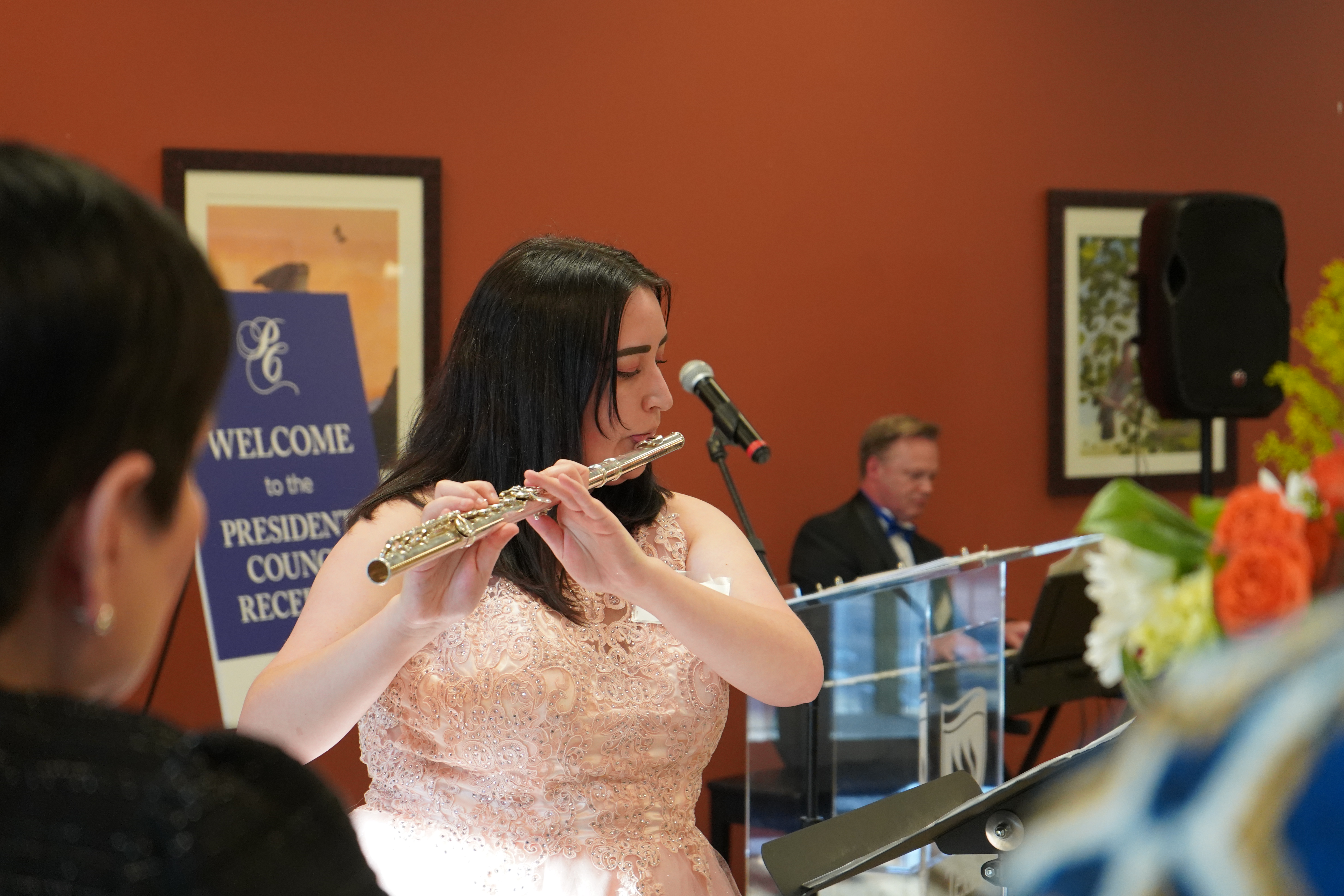 A young woman playing the flute