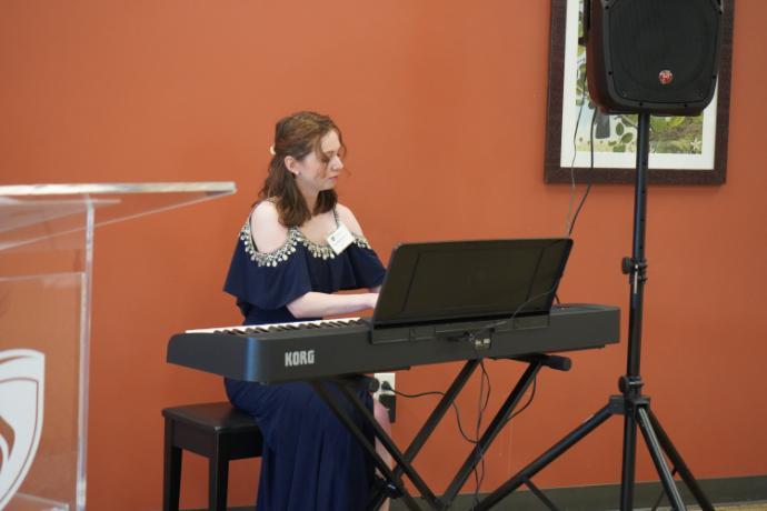 A young woman playing the keyboard
