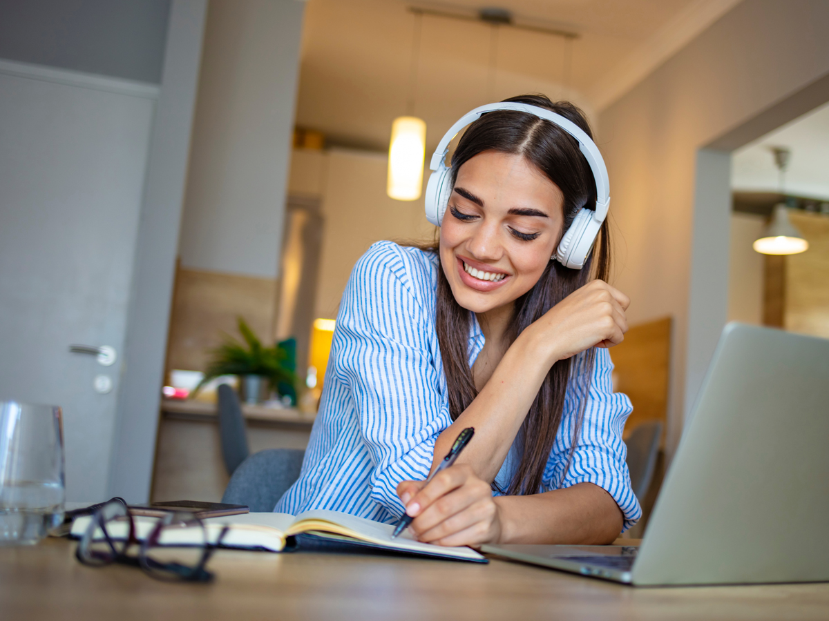 Young female education student working at her laptop