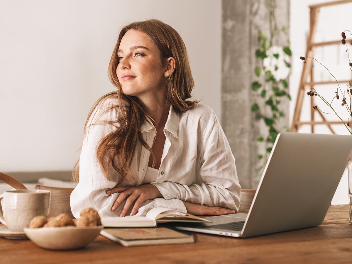 Portrait of a woman smiling satisfyingly looking into the distance