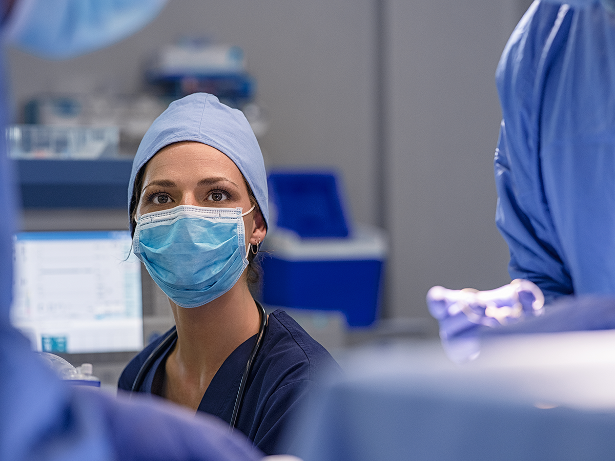 Woman in operating room mask