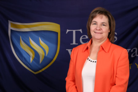 Center for Excellence in Teaching and Learning (CETL)Instructional Technologist Gwen Williams with shield background