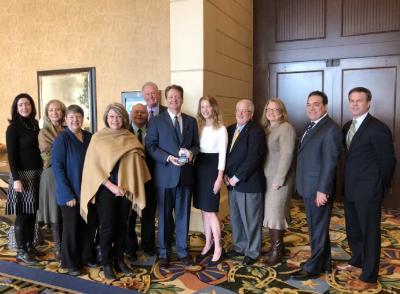 Photo of group with Texas Wesleyan President Fred Slabach at CASE award event.