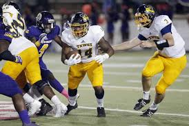 Football of texas wesleyan foobtall player during game in 2017 season.