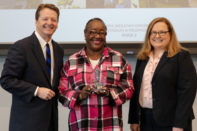 President Fred Slabach, Elaine Robinson and Donna Nance pose for a picture after Djuana receives Staff Hero award