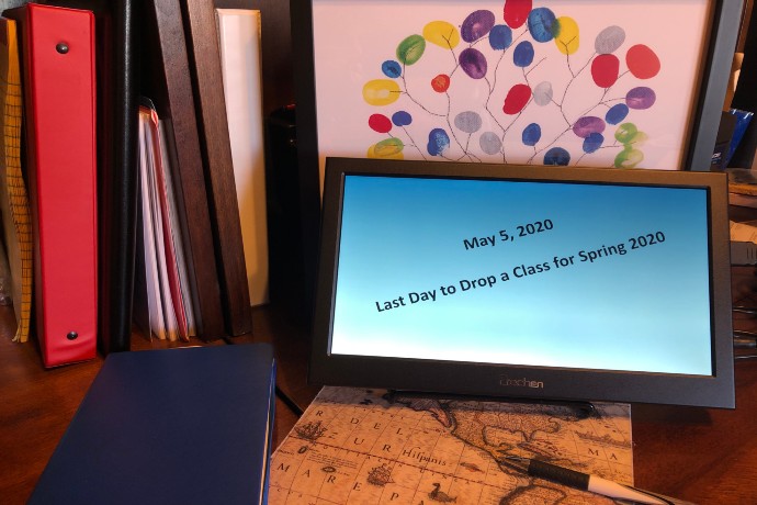 A tablet on a desk announcing last day to drop a class for Spring 2020 is May 5th.