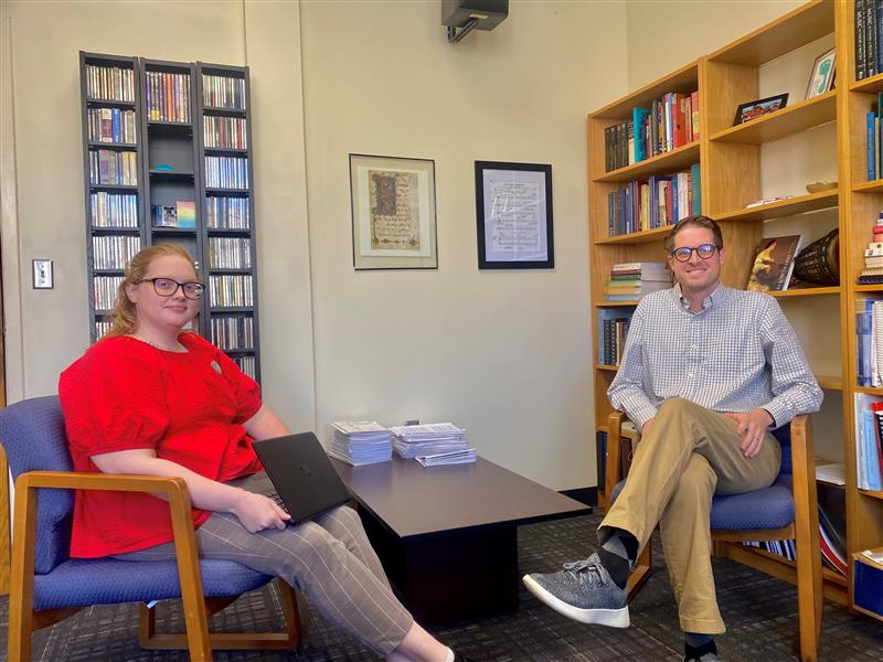 Dr. Bradley Naylor sitting comfortably crossed legged in chair