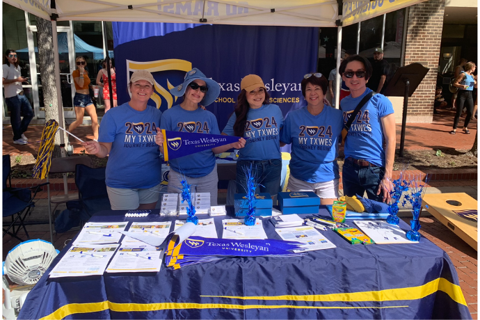 Students and Staff at the TXWES booth in downtown Fort Worth for the Michelada Festival