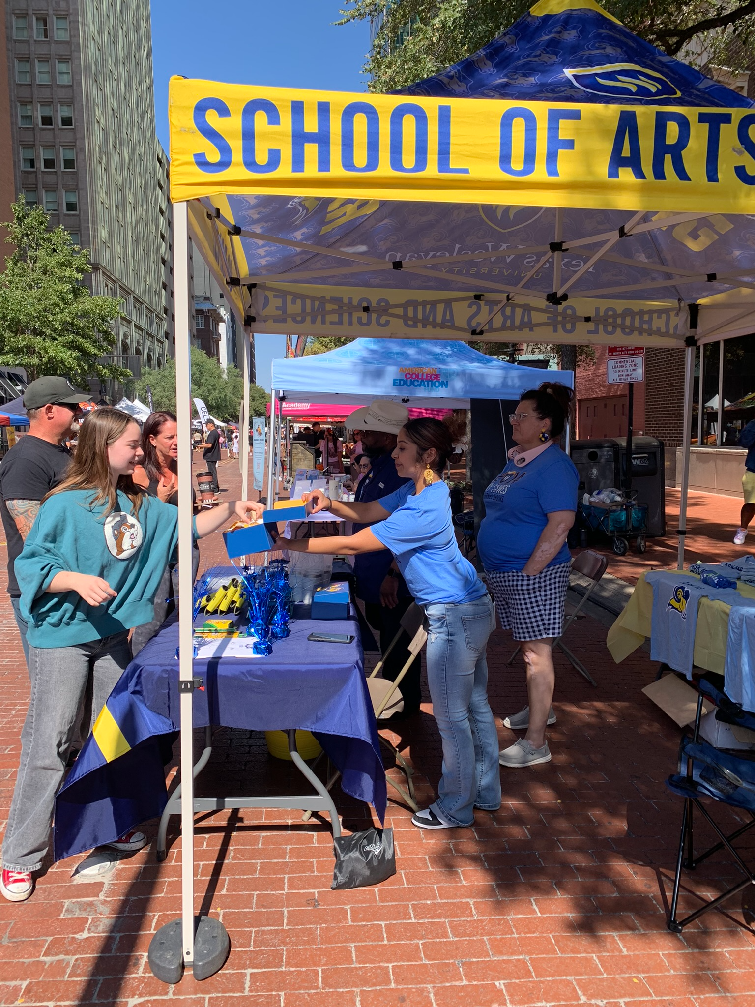 Students and Staff at the TXWES booth in downtown Fort Worth for the Michelada Festival