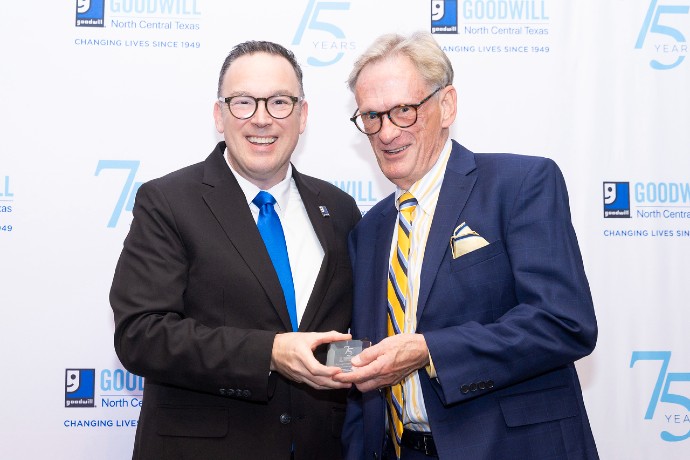 Joe Brown poses with award