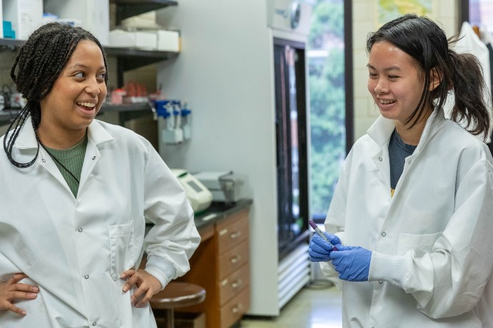 Interns Rona and Katherine laugh as they share their experiences working in the lab