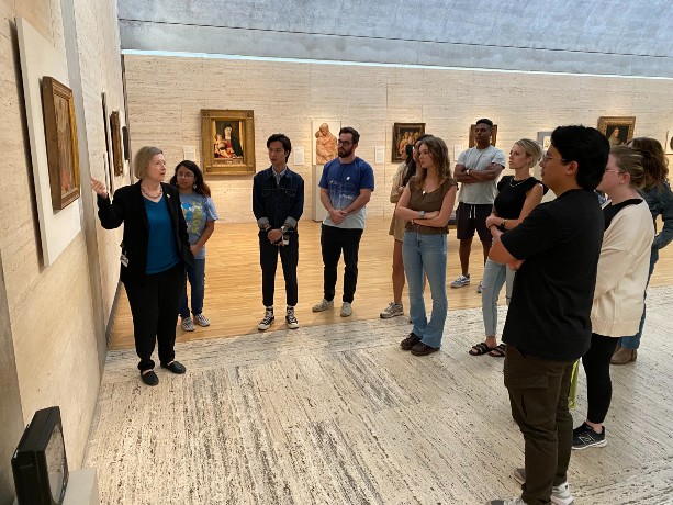 Students and Docent gathered around a work at the Kimbell Museum