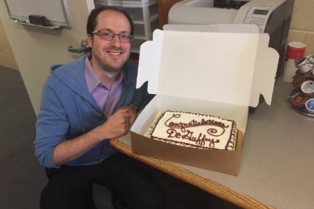 Dr. Tom Guffey and his congratulation cake.