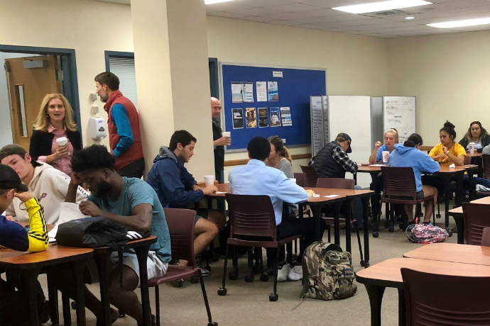 Students gather during the Entrepreneurship Club meeting to listen to guest speakers about the upcoming Fort Worth StartUp Weekend.