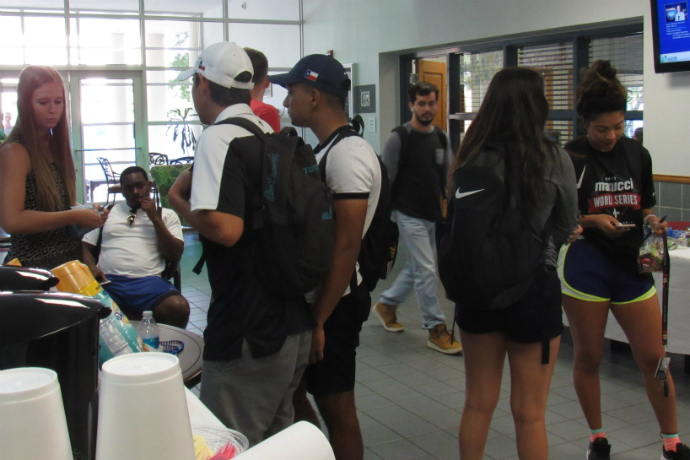 Photo of Texas Wesleyan Business students enjoying the Open House event in the atrium of the business building