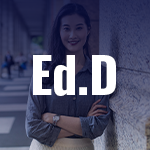 Ed.D Letters in foreground woman smiling in background