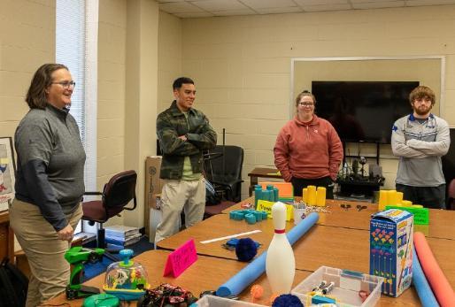 Students work on modifying toys for disability sports event