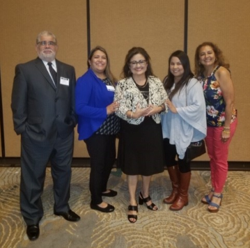 Photo of Dr. Patsy Robles-Goodwin and group at the Quest for Quality Award.