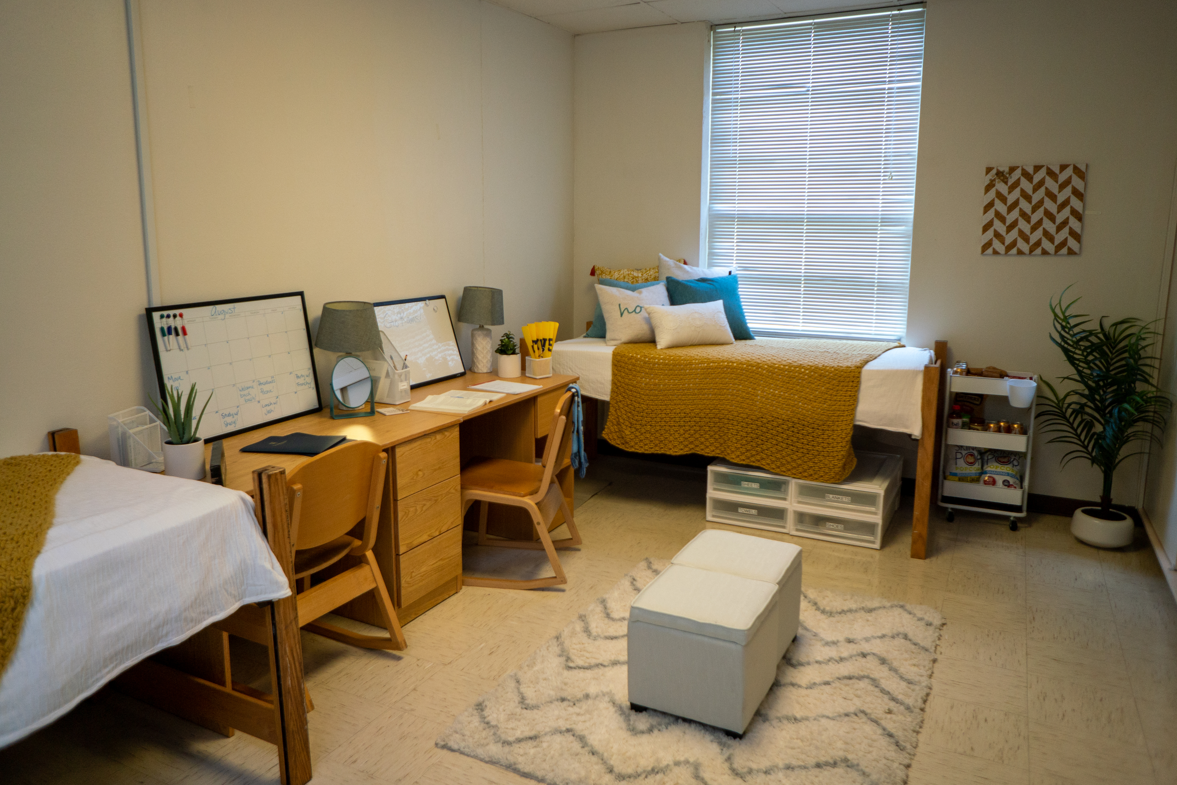 Student's decorated Stella room with bed and desk on window side
